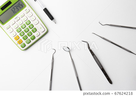 Dental instruments and calculator Dental instruments and calculator 67624218
