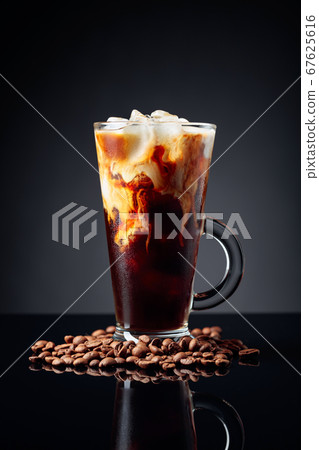 Ice coffee in frozen glass and coffee beans on a 67625616