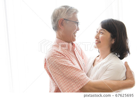 Senior couple looking into each other Senior couple looking into each other 67625695