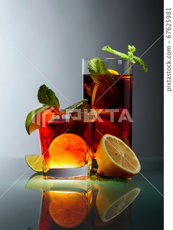 Ice tea with lemon, lime and mint. 67625981