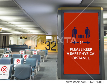 airport board with sign for social distancing around departure gate at airport terminal, sign for warning traveler during travel on epidemic of coronavirus (covid-19) virus situation, new normal 67626010