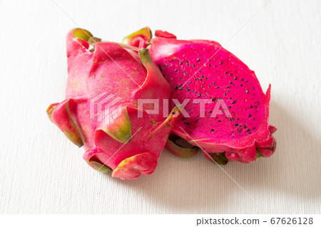 Dragon fruit (red meat) cut in half made in Vietnam 67626128