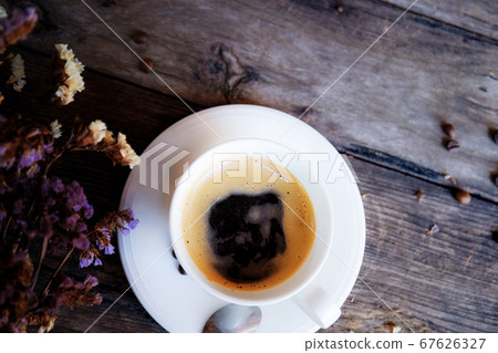 Black coffee on wooden. 67626327