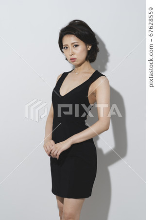 A woman in a dress A woman in a dress 67628559