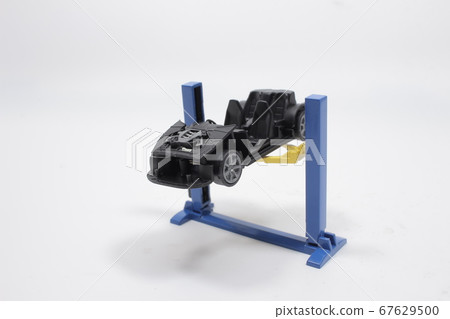 Auto Repair Shop Interior with Mechanic in 67629500