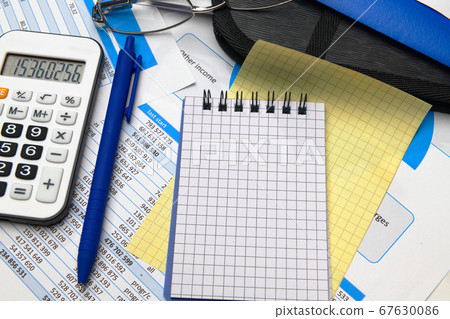 business office desk closeup - financial reports, business office desk closeup - financial reports, 67630086