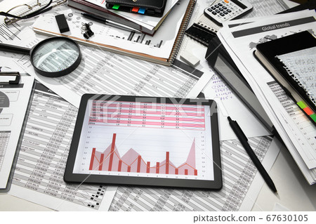 business office desk closeup - tablet computer 67630105