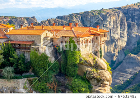 Greek Rock Monastery Among Green Trees on a Sunny 67632482