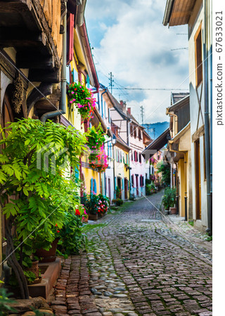 Traditional french houses and shops in Eguisheim, 67633021