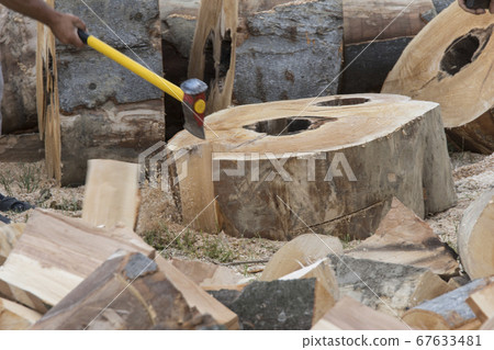 chopping firewood with the cleaver chopping firewood with the cleaver 67633481