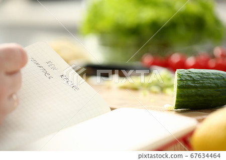 Housewife cooking new vegetable meal in kitchen Housewife cooking new vegetable meal in kitchen 67634464