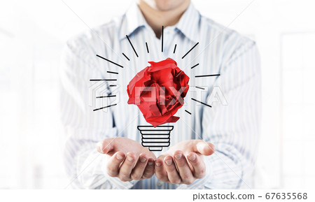 Concept of idea and inspiration presented by paper crumped ball. Mixed media 67635568