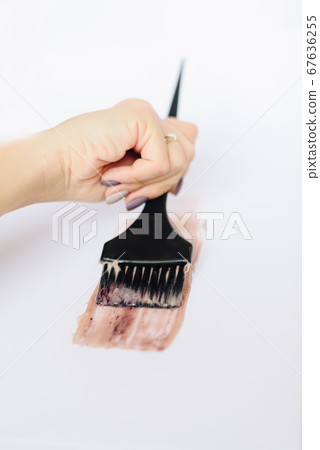 Black brush with hair dye on a white background Black brush with hair dye on a white background 67636255