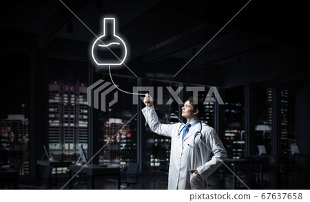 Doctor and medical vial symbol 67637658