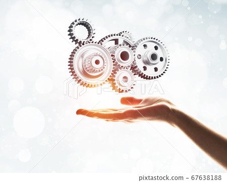 Concept of teamwork and cooperation presented with working gear engine 67638188