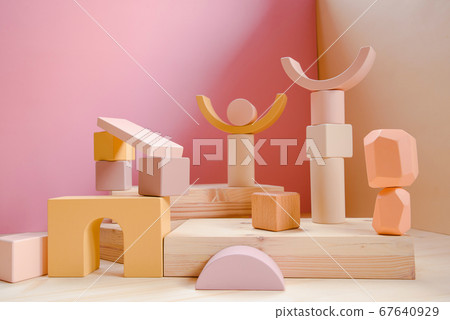 A town made of elements of a wooden children's designer of pastel colors. A town made of elements of a wooden children's designer of pastel colors. 67640929