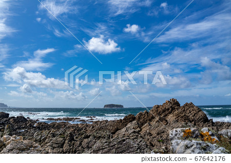 Glashedy Island is an uninhabitated island apprimately 1 mile of Pollen strand west of Trawbreaga Bay. Here seen from the castles - Donegal, Ireland 67642176