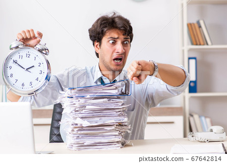Overloaded busy employee with too much work and paperwork 67642814