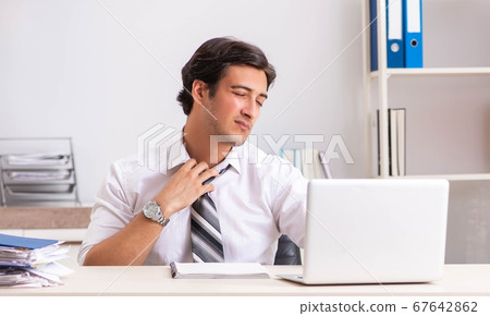 Young handsome businessman working in office 67642862