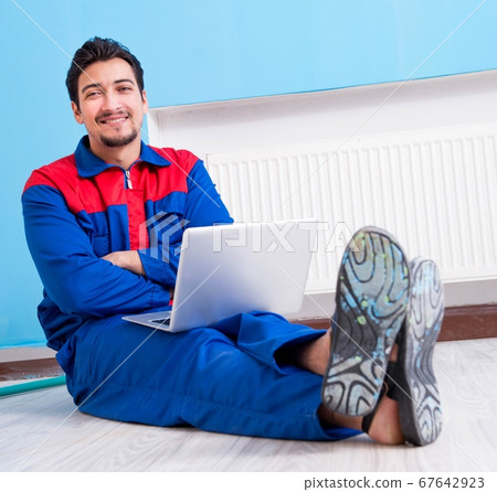 Young painter doing renovation at home Young painter doing renovation at home 67642923