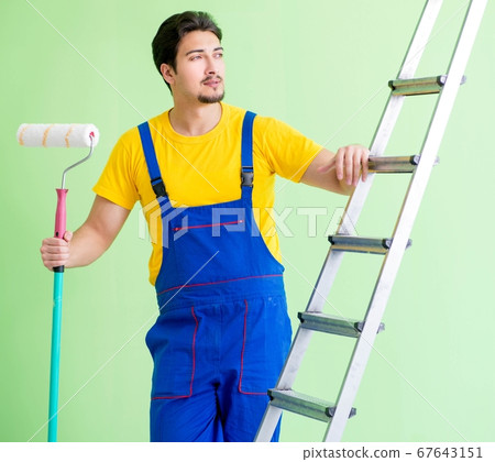 Young painter doing renovation at home Young painter doing renovation at home 67643151