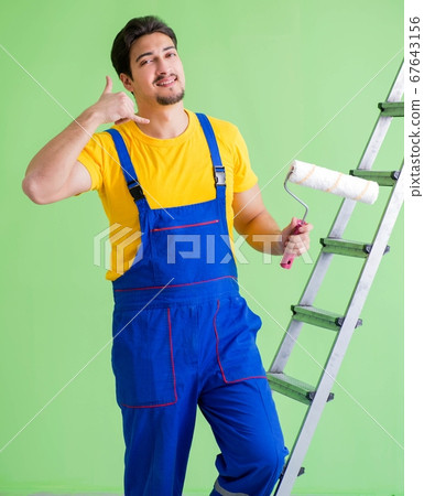 Young painter doing renovation at home Young painter doing renovation at home 67643156