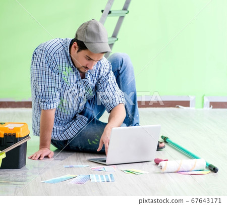 Young man doing home renovation 67643171