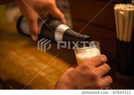 Drink beer at an izakaya Drink beer at an izakaya 67643322