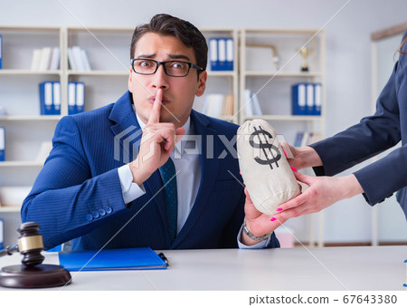 Judge in bribe concept with money Judge in bribe concept with money 67643380