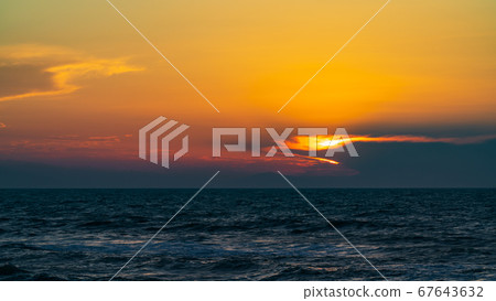Dark dramatic sunset over the sea 67643632