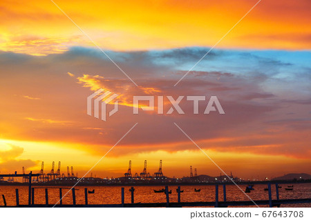 cranes on seaport and sunset red blue sky and cranes on seaport and sunset red blue sky and 67643708