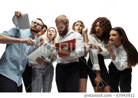 Nervous tensioned investors analyzing crisis stock market with charts on screen of their gadgets Nervous tensioned investors analyzing crisis stock market with charts on screen of their gadgets 67643912