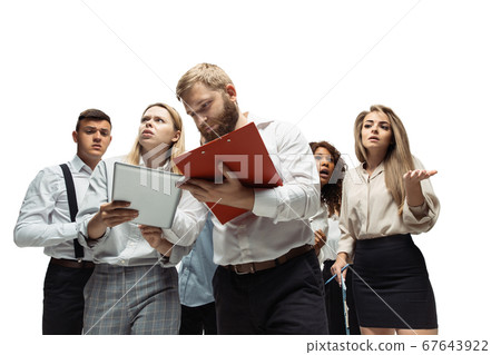 Nervous tensioned investors analyzing crisis stock market with charts on screen of their gadgets Nervous tensioned investors analyzing crisis stock market with charts on screen of their gadgets 67643922