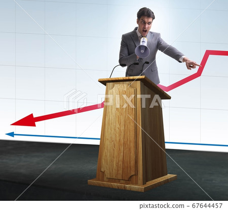 Man businessman making speech at rostrum in business concept 67644457
