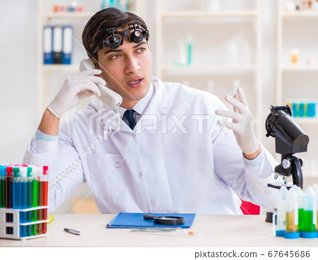 Young chemical scientist working in lab 67645686