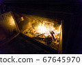 Western fireplace where firewood burns 67645970