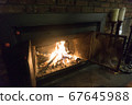 Western fireplace where firewood burns 67645988