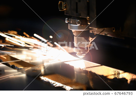Sparks flying out of machine head during production process 67646793