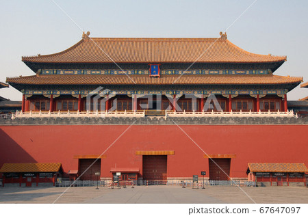 Forbidden City, Beijing, China. The entrance to the Forbidden City has a sign saying 'Meridian Gate'. Entrance signs are Chinese with English translations. The Forbidden City has Chinese architecture. 67647097