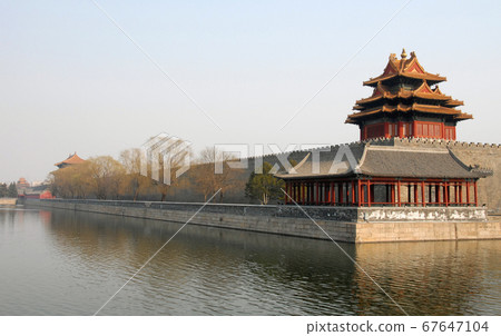 Forbidden City, Beijing, China. A corner tower seen from outside the Forbidden City. The Forbidden City has traditional Chinese architecture. The Forbidden City is also the Palace Museum, Beijing. Forbidden City, Beijing, China. A corner tower seen from outside the Forbidden City. The Forbidden City has traditional Chinese architecture. The Forbidden City is also the Palace Museum, Beijing. 67647104