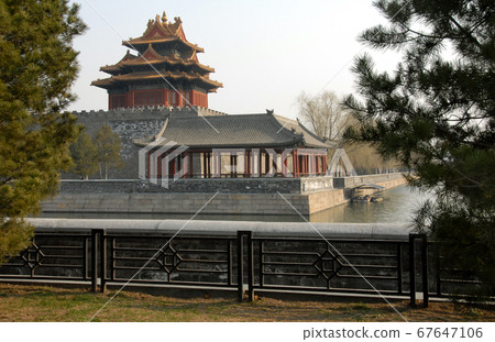 Forbidden City, Beijing, China. A corner tower seen from outside the Forbidden City. The Forbidden City has traditional Chinese architecture. The Forbidden City is also the Palace Museum, Beijing. 67647106