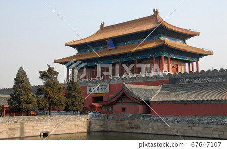 Forbidden City, Beijing, China. The sign says: Gate of Divine Might, the exit from the site. The Forbidden City has traditional Chinese architecture. The Forbidden City is the Palace Museum, Beijing. Forbidden City, Beijing, China. The sign says: Gate of Divine Might, the exit from the site. The Forbidden City has traditional Chinese architecture. The Forbidden City is the Palace Museum, Beijing. 67647107
