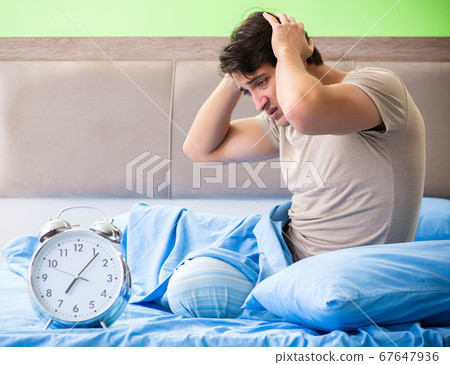 Man having trouble with his sleep Man having trouble with his sleep 67647936