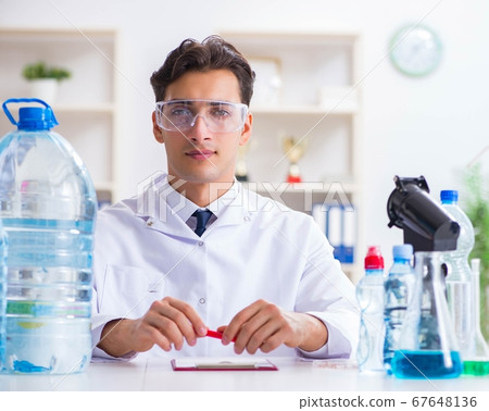 Lab assistant testing water quality 67648136