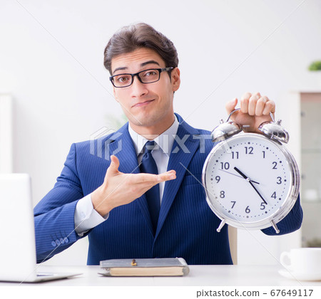 Businessman employee in urgency and deadline concept with alarm Businessman employee in urgency and deadline concept with alarm 67649117