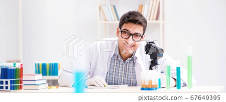 Chemistry student doing chemical experiments at classroom activi Chemistry student doing chemical experiments at classroom activi 67649395