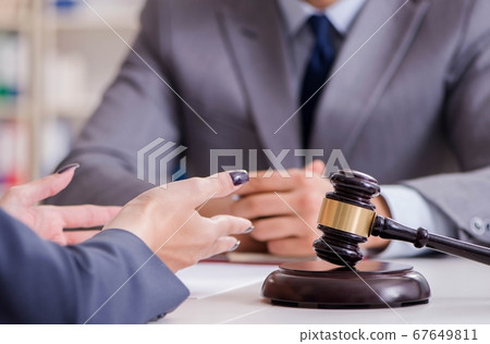 Lawyer discussing legal case with client 67649811