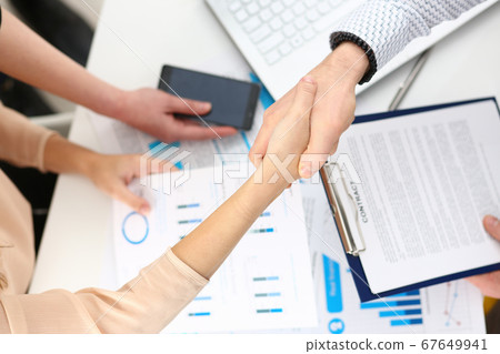 Close up of people that shaking hands Close up of people that shaking hands 67649941