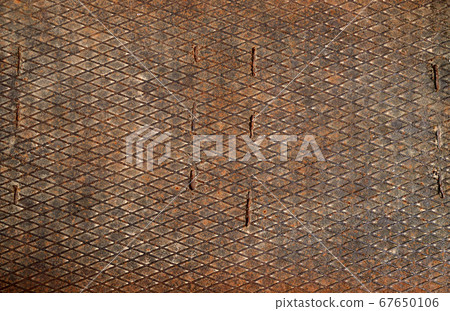 rusty metal sheet with a grid as the background 67650106