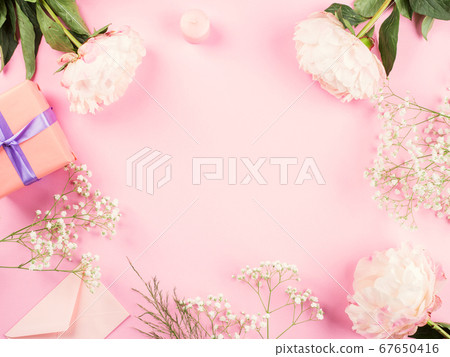 Pink pastel background with floral decor peonies 67650416